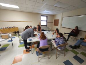 League members help girl scouts earn their democracy badges.